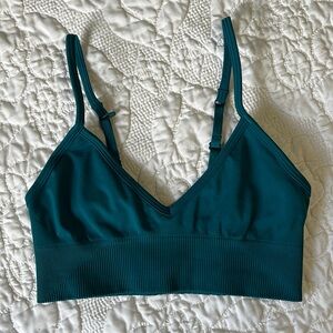 Turquoise colored Lululemon sports bra.